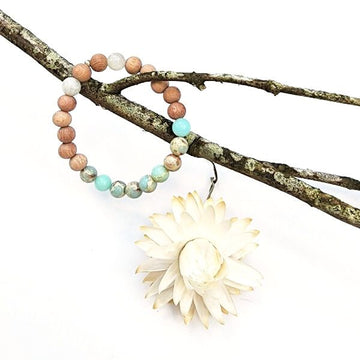 Handmade Focusing Bracelet – Rosewood, Moonstone & Jasper hanging on branch
